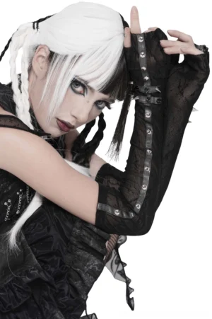 Close-up side view of black gothic arm sleeves showing rivet trim details and fingerless design on model with alternative hairstyle