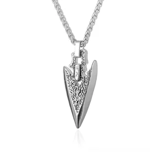Silver crack-pattern engraved arrowhead pendant necklace - gothic statement jewelry flat lay