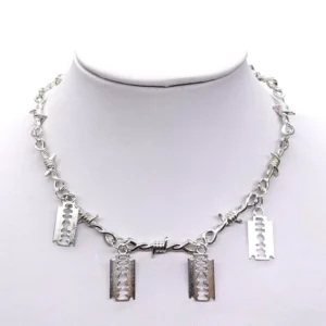 Silver gothic barbed wire choker with razor blade pendants displayed on mannequin neck, front view showing industrial design and blade details