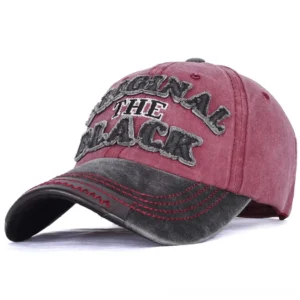 Distressed black and red gothic baseball cap with embroidered slogan front three-quarter view