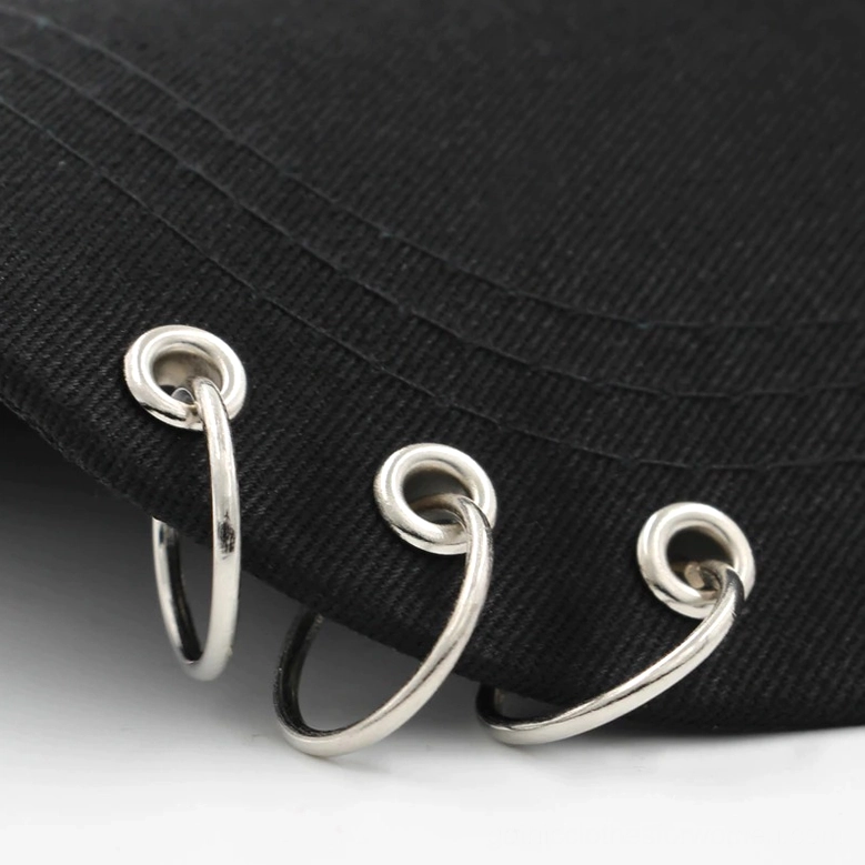 Gothic baseball cap metal ring piercing hardware and chain decoration closeup
