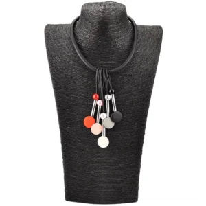 Black elastic silicone gothic choker necklace with mixed color bead pendants shown on dark fabric display form