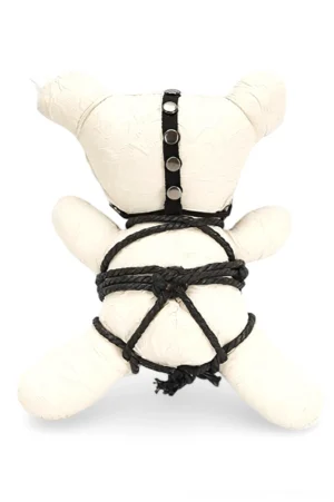 Gothic punk bear plush rear view showing studded harness and black rope bondage ties