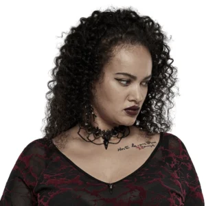 Victorian gothic lace choker with matte black bird skull pendant, side profile worn by alternative model