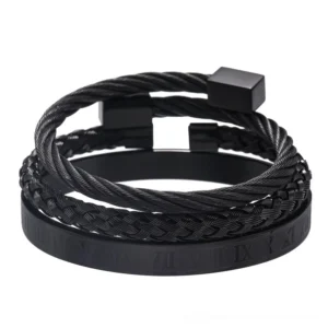 Gothic black stainless steel 3-piece bangle set with twisted cable design and Roman numeral engravings, punk-inspired dark metal bracelets flat lay