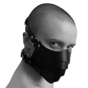 Gothic black leather layered face mask worn by male model showing front three-quarter view with metal hardware details