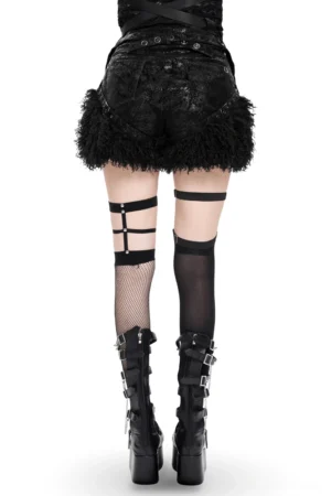 Back view of gothic black faux leather shorts with fur trim, displaying back waist details and thigh garters