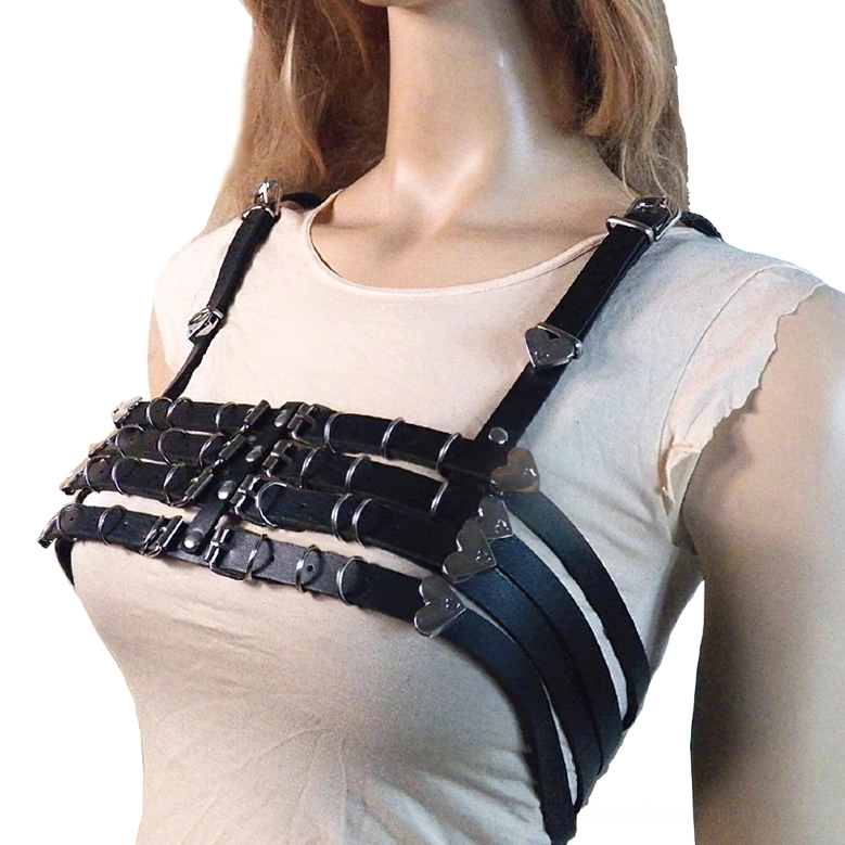 Black PU leather heart harness bra front left three-quarter view, showcasing adjustable metal heart buckles and multi-strap gothic chest piece design