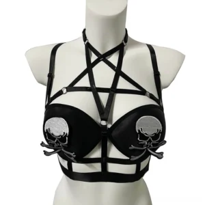Gothic black pentagram bra with silver skull embroidery - front three-quarter view on mannequin showcasing strappy harness design and asymmetrical skull patches