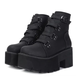 Black gothic platform ankle boots with multiple buckle straps, chunky block heel and lugged sole, front three-quarter view
