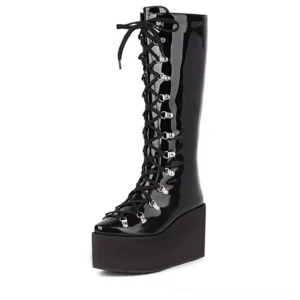 Gothic black patent leather platform boots front view with lace-up detail and metal eyelets