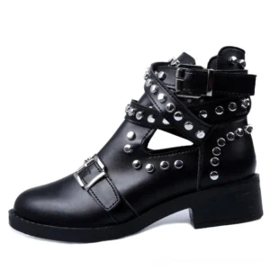 Black studded ankle boots with silver rivets and buckle straps, left three-quarter view on white background