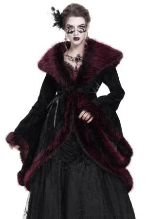 Gothic black velvet coat with burgundy faux fur collar and trim, worn by model in front pose showing full-body silhouette and detailed embellishments