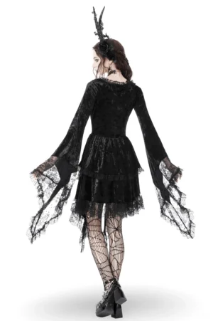 Black gothic velvet lace dress back view showing irregular asymmetrical hemline and fitted waist