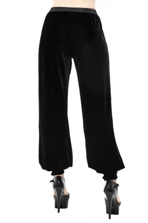 Black gothic velvet flared trousers rear view showing elasticated ankle cuffs