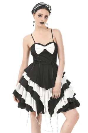 Black and white tiered ruffle gothic dress front view with white bow and lace corset top on model