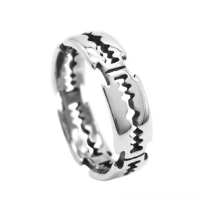 Stainless steel blade ring with sawtooth texture, polished silver finish, oblique close-up on white background, gothic punk jewelry
