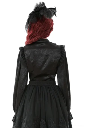 Black gothic blouse back view showing high stand collar and ruffled shoulder details on model with dramatic silhouette