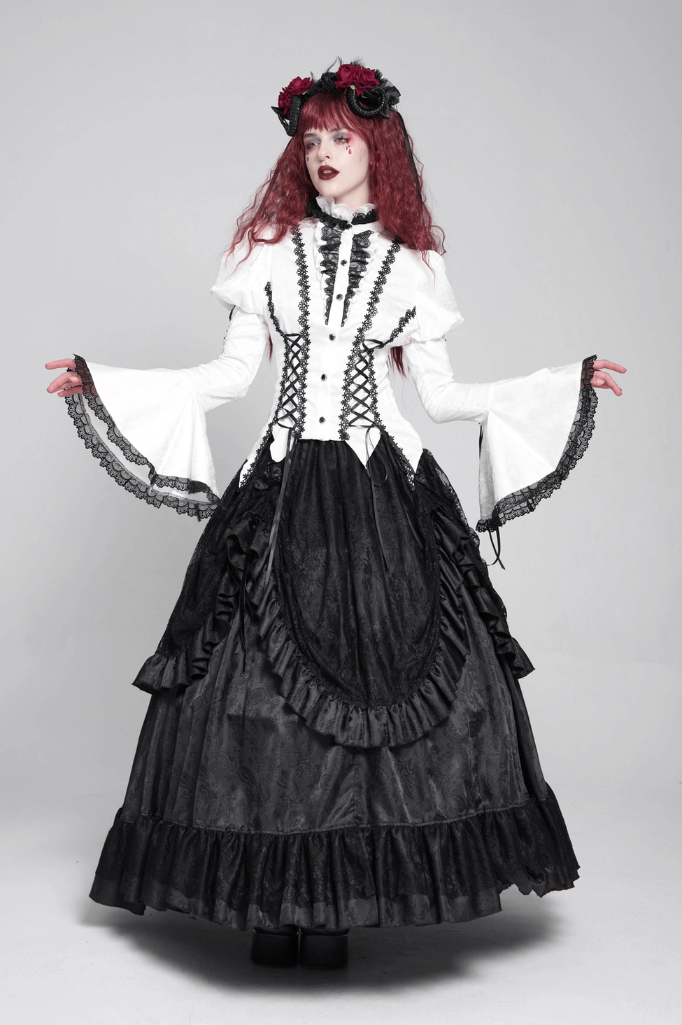 White gothic victorian blouse front button and corset detail showing decorative button placement and lacing precision