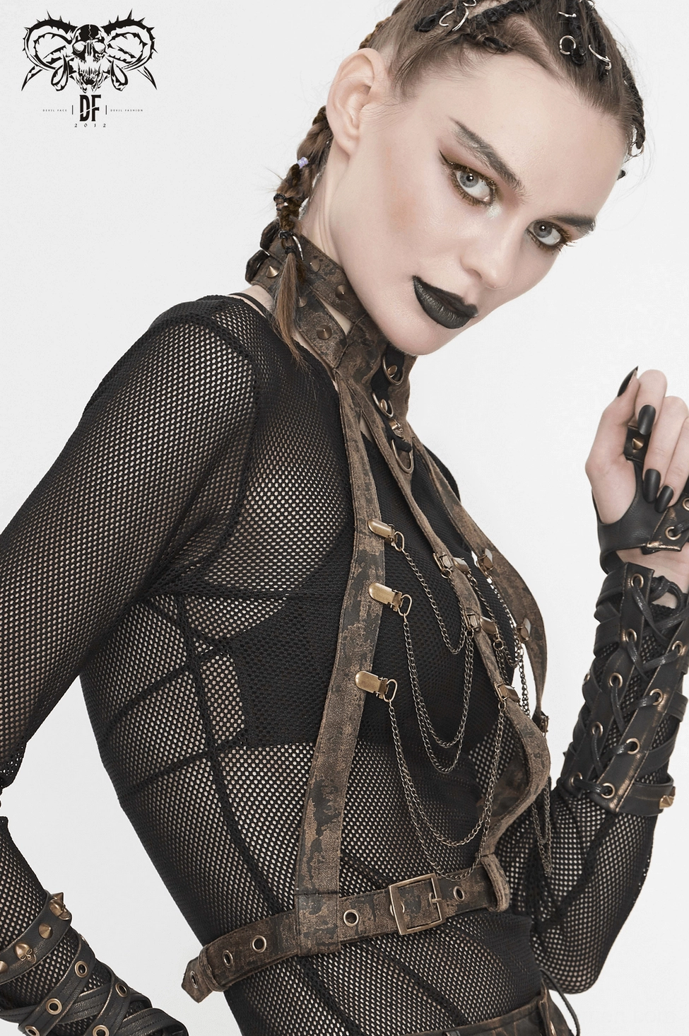 Detailed view of gothic body harness construction with bronze hardware, chains, and layered leather straps