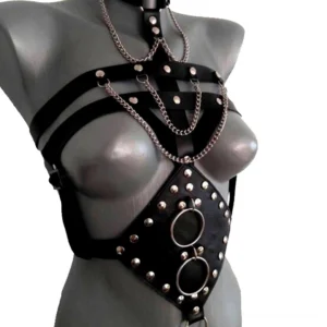 Gothic chest harness left three-quarter angle showing adjustable side straps and metal chain details on mannequin