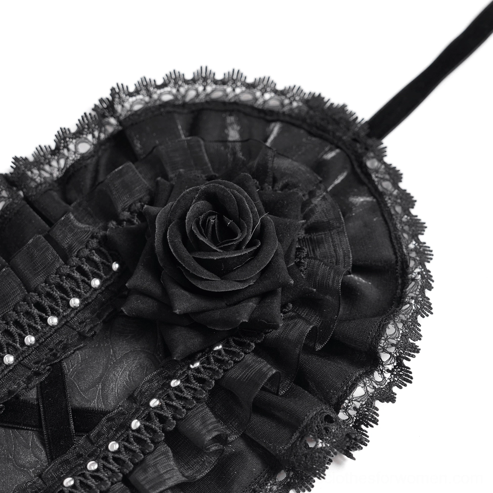 Detailed view of black gothic lace bonnet showing intricate lace construction, rose embellishment placement, and ruffled layers