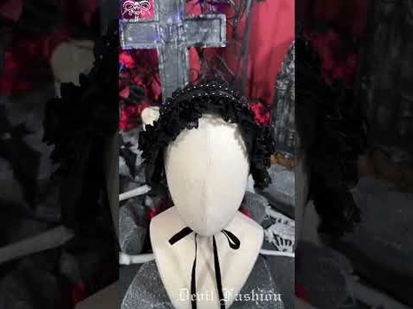 Gothic lace bonnet displayed from right side angle on mannequin head, highlighting 3D rose decor and ribbon tie attachment