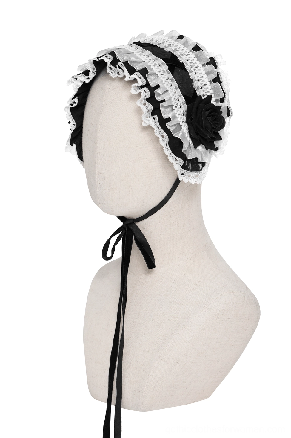 Three-quarter side view of gothic lace bonnet on mannequin with single black rose and ruffled trim details