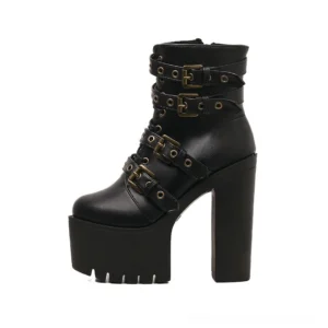 Left side three-quarter view of black gothic ankle boots featuring antiqued metal buckles, thick platform sole, and industrial-style hardware