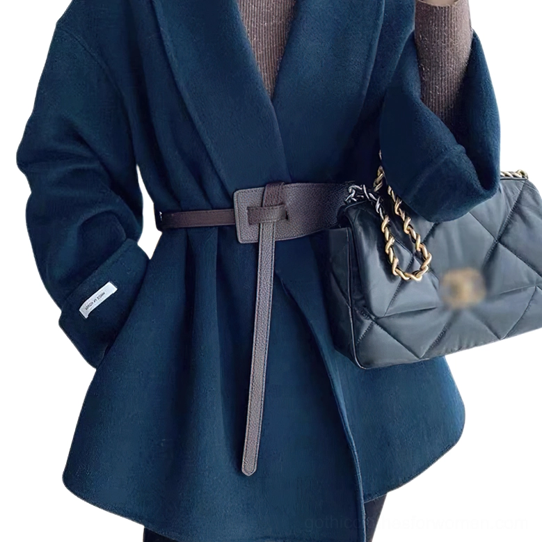 Grayish brown knotted PU leather belt with long leather tail worn with navy wool wide coat, waist side view with crossbody handbag styling