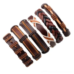 Dispersed brown leather bracelets flat lay, displaying individual woven and braided designs with geometric rope patterns for gothic style collection