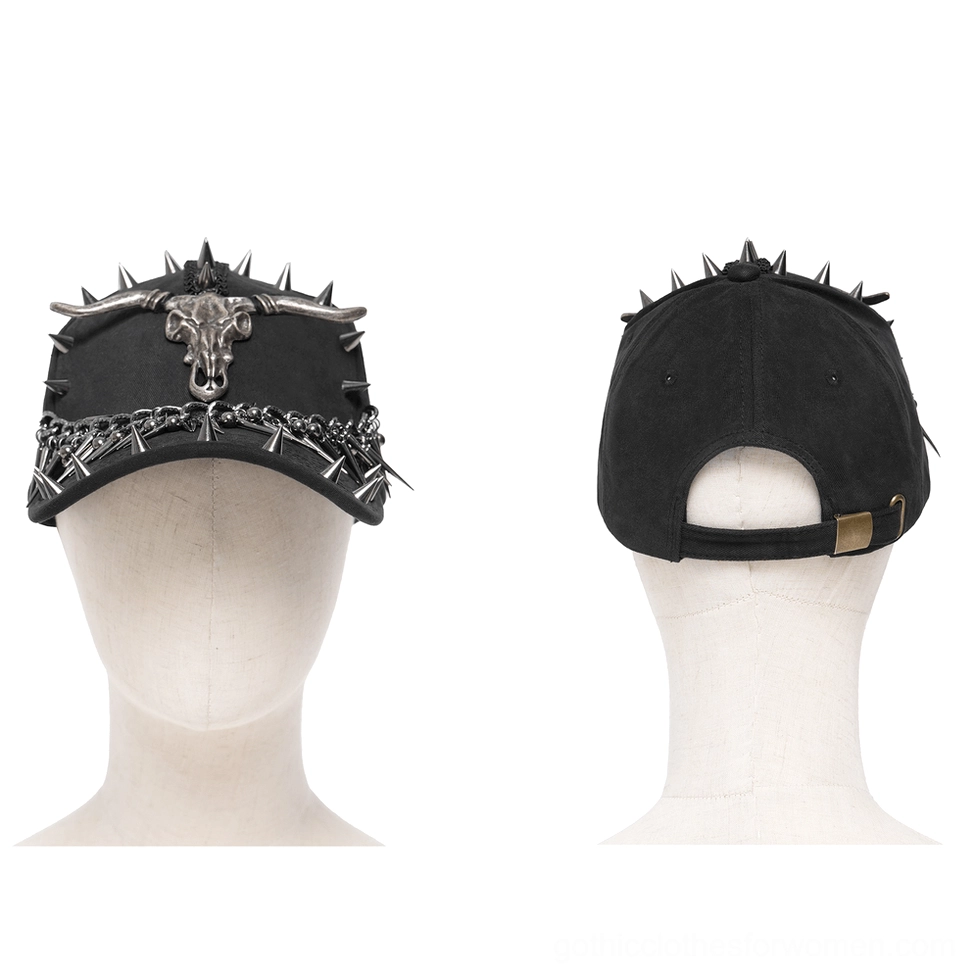 Black gothic baseball cap with metal bull skull emblem and spike chain trim displayed on mannequin front view