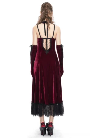 Burgundy gothic velvet dress with halter back straps and black lace hem, back full-body view showcasing cutout details