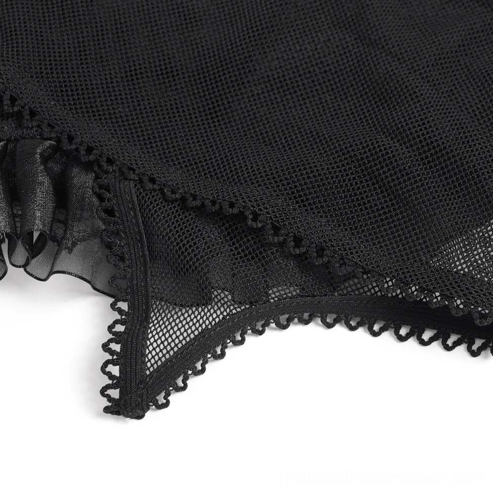 Alternative fashion styling of black mesh gothic bustier paired with goth aesthetic accessories and dark wardrobe elements