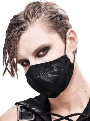 Gothic black butterfly face mask with silver embroidered wing design, worn by male model in left three-quarter view showing intricate gothic embroidery details