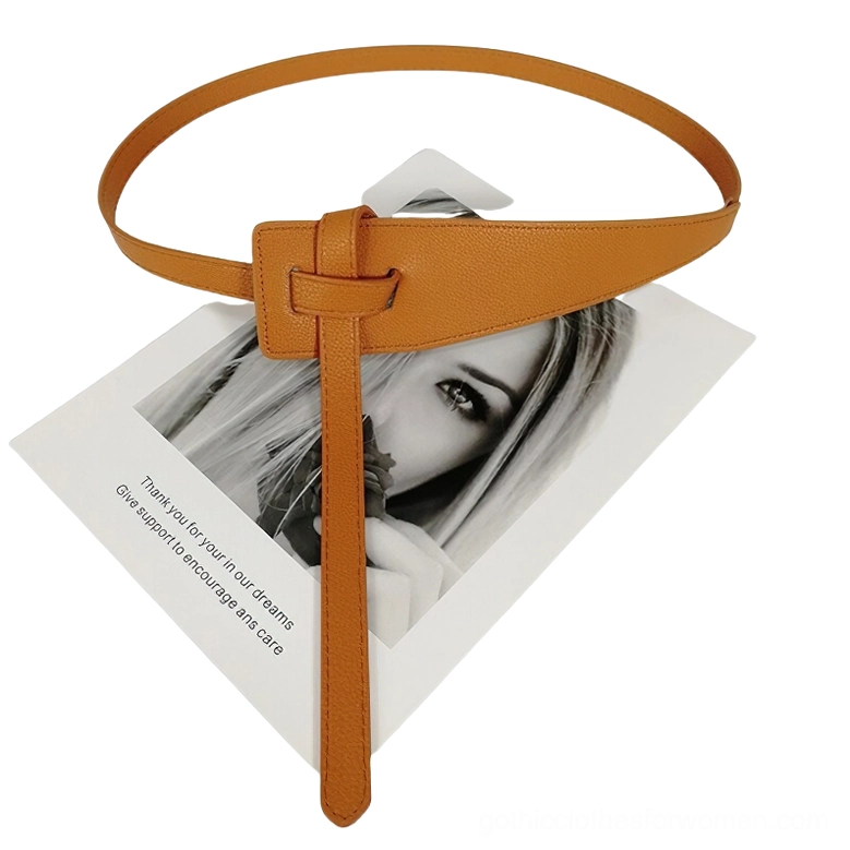 Tan orange camel-toned knotted PU leather belt with decorative knot closure and long leather tail, flat lay top view
