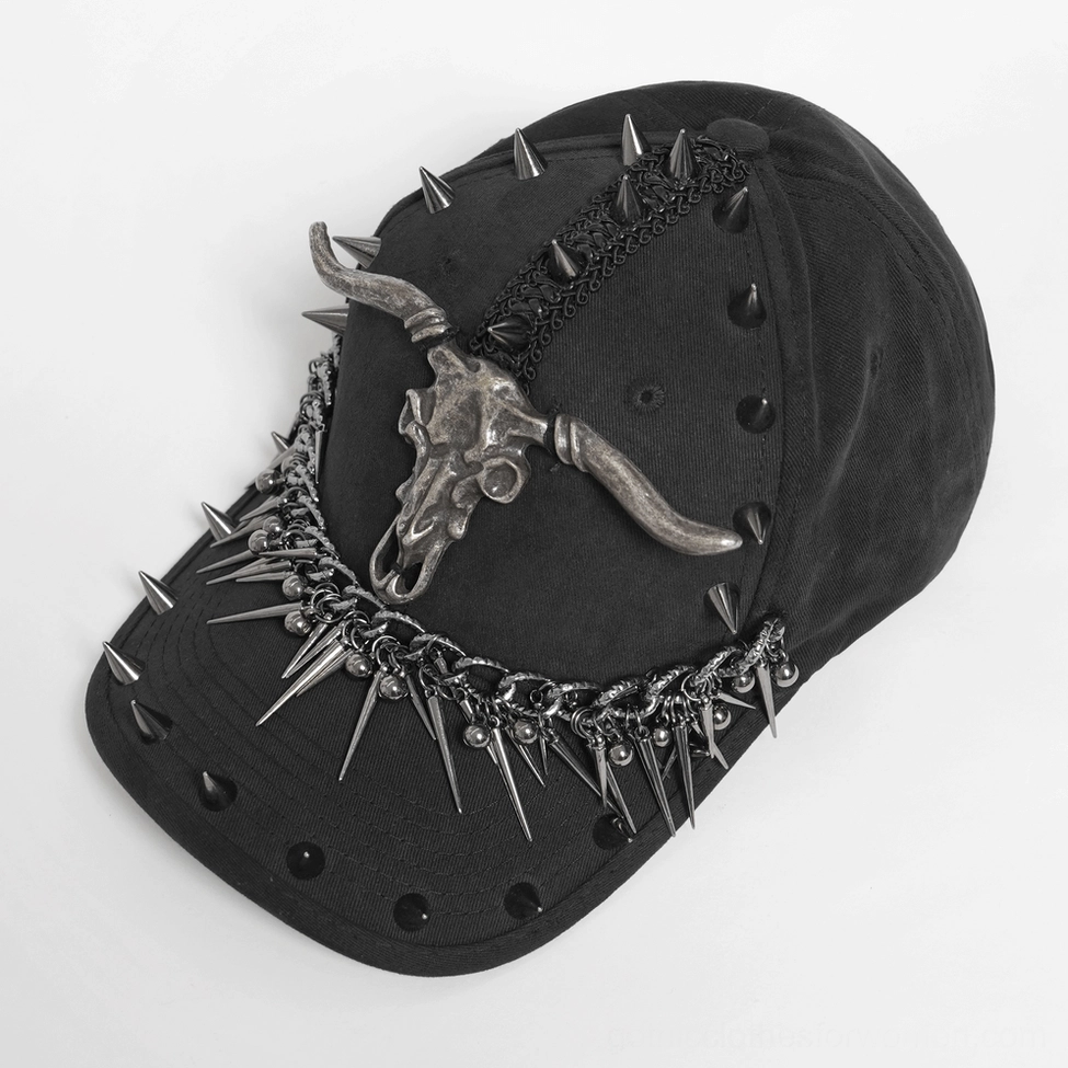 Flat lay top-down view of metal spike bull skull gothic baseball cap showing crown spike studs and chain details