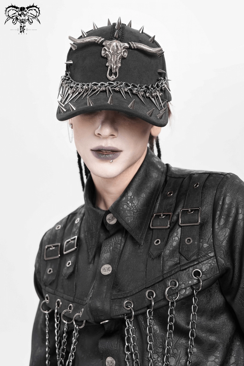 Gothic bull skull baseball cap with metal spikes and chains front angle detail on mannequin display