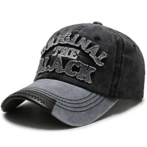 Faded gray and black two-tone goth snapback cap with distressed fabric texture