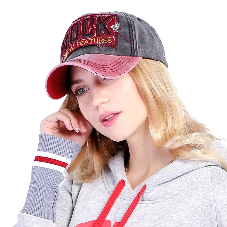 Model wearing maroon and red gothic rock baseball cap styling portrait showing casual alternative fashion