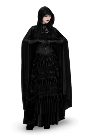 Black velvet gothic cape with skull embroidery worn by model in front view, floor-length design with attached hood