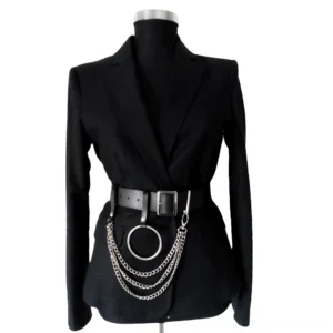 Gothic black faux leather chain belt harness with silver metal rings and chains, worn on dress form in front view against white studio background
