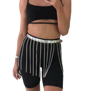 Black holographic chain body harness worn by model, front view showcasing iridescent PVC strap with cascading silver chain tassels