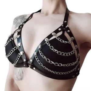 Gothic padded chain bra harness top with silver chains and rivets - close-up chest detail