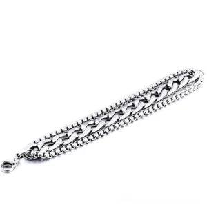 Double-row curb chain gothic bracelet flat lay on white background, polished stainless steel link design