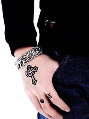 Dual-layered gothic chain bracelet worn on male wrist, silver stainless steel with twisted and curb chain links, casual daily style