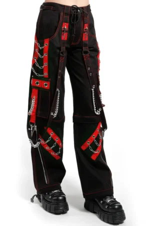 Black gothic chain cargo pants close-up detail view showing chain strap embellishment and red stitching on front leg
