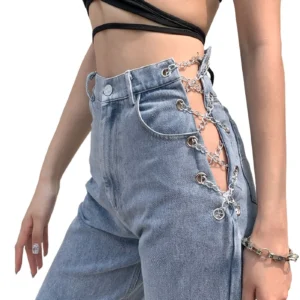 High-waist chain-lace gothic denim jeans side view on female model, washed blue denim with cutout detail