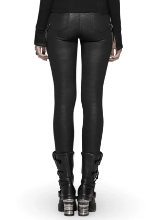 Black gothic leather leggings rear view showcasing back patch pockets and side waist chain accents with platform boots