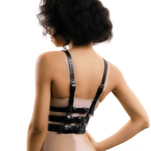 Black PU leather chest harness rear view showing adjustable back buckles and multi-strap construction